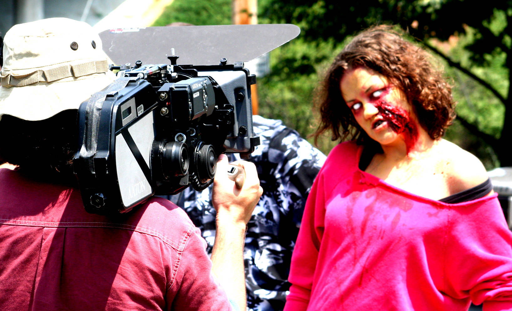 on movie set with zombie with a camera man filming